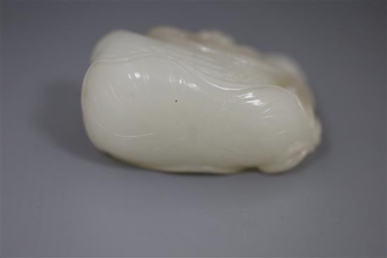 A Chinese white jade group of mandarin ducks, 19th/20th century, L. 4.8cm, wood stand